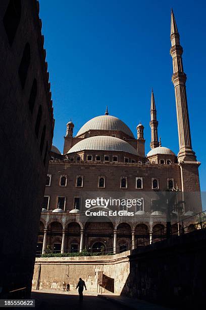 Man walks along a road below the Muhammad Ali Mosque in Cairo's Citadel on October 21, 2013 in Cairo, Egypt. The Muhammad Ali Mosque, completed in...