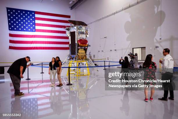 People gather around the Nova-C lunar lander at Intuitive Machines on Monday, Oct. 2 in Houston. The lander was put on display during a media open...