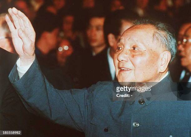 This photo dated 19 October 1992 shows senior Chinese leader Deng Xiaoping waving during the 14th Communist Party Congress. The Chinese media broke a...