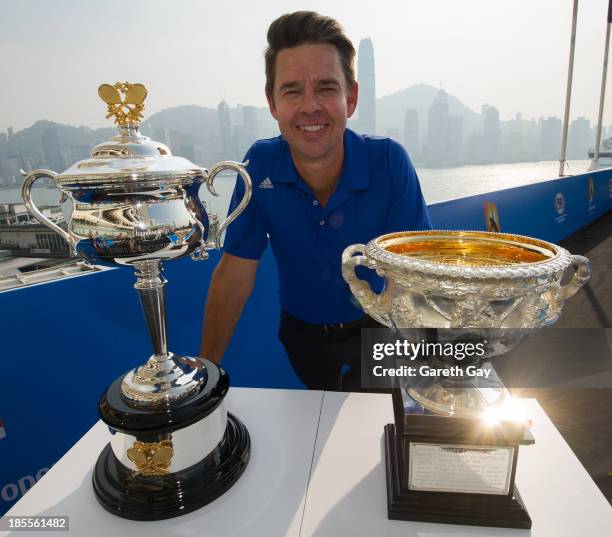 Todd Woodbridge poses for the press, with the AO trophys over looking the Hong Kong skyline during the Australian Open Trophy tour on October 22,...