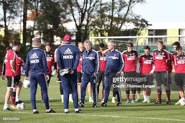 Gertjan Verbeek and Raymond Libregts, new coaches of 1. FC Nuernberg welcome the players prior to a practicing session on October 22, 2013 in...