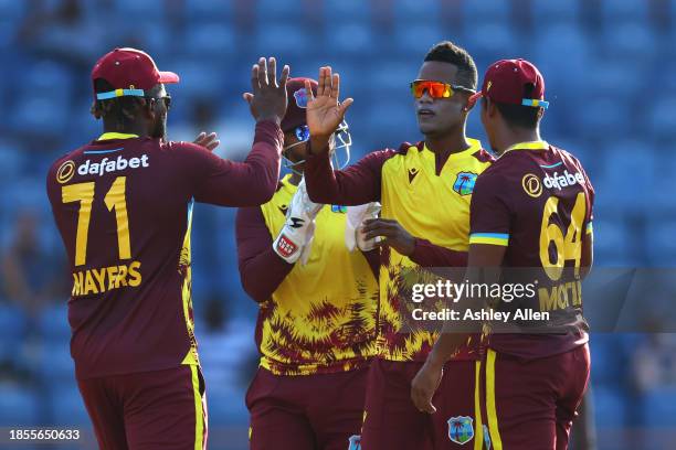 Akeal Hosein of West Indies celebrates with teammates after getting the wicket of Harry Brook of England during the 2nd T20 International match...