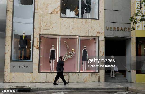 Shoppers make their way through the Miami Design District featuring stores from many luxury fashion names on December 14, 2023 in Miami, Florida. The...