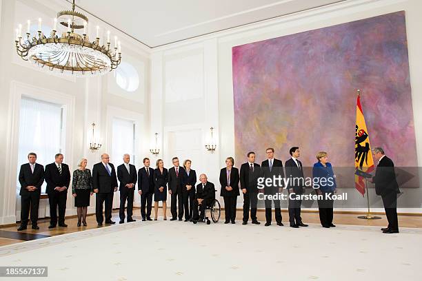 Members of the German Government pose for a photo after German President Joachim Gauck handed out dismissal certificates at a ceremony for the...