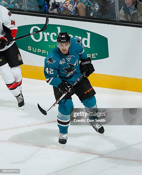 Matt Pelech of the San Jose Sharks skates after the puck against the Ottawa Senators during an NHL game on October 12, 2013 at SAP Center in San...