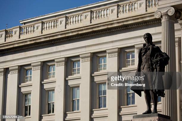 Statue of Alexander Hamilton, the first U.S. Treasury secretary, stands at the U.S. Treasury in Washington, D.C., U.S., on Monday, Oct. 21, 2013....