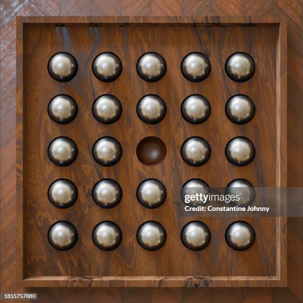 vintage wooden board with shiny metal balls and one is missing. problem solving concept. - solitaire stock pictures, royalty-free photos & images