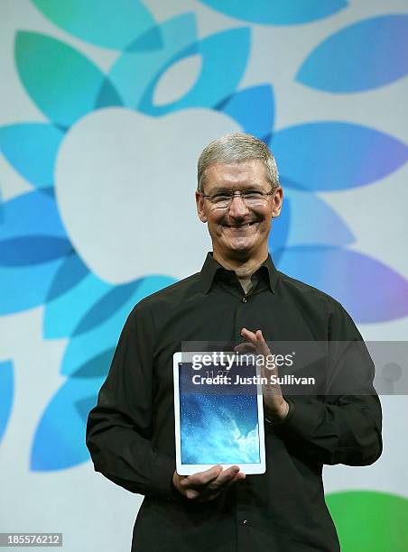 Apple CEO Tim Cook holds the new iPad Air during an Apple announcement at the Yerba Buena Center for the Arts on October 22, 2013 in San Francisco,...