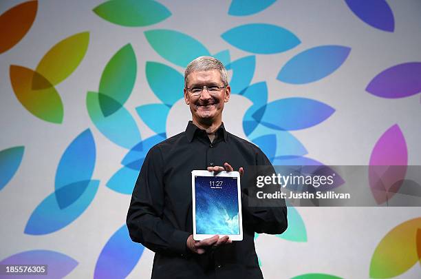 Apple CEO Tim Cook holds the new iPad Air during an Apple announcement at the Yerba Buena Center for the Arts on October 22, 2013 in San Francisco,...