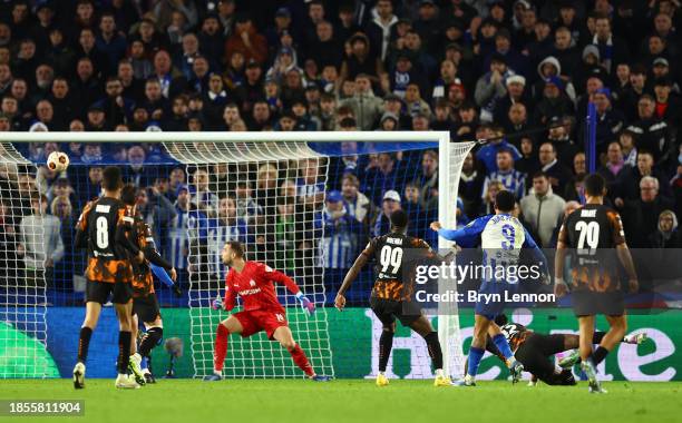 Joao Pedro of Brighton & Hove Albion scores their team's first goal past Pau Lopez of Marseille during the UEFA Europa League match between Brighton...