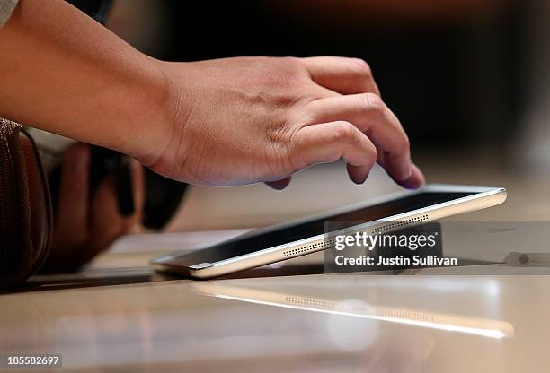 An attendee looks at the new iPad Air during an Apple announcement at the Yerba Buena Center for the Arts on October 22, 2013 in San Francisco,...