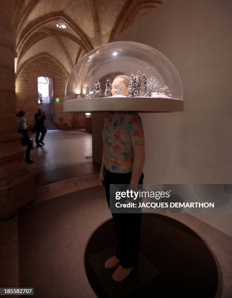 The artwork "The Past is a Foreign Country" by German artist Friedrich Kunath is displayed on October 22, 2013 at the Conciergerie museum in Paris,...