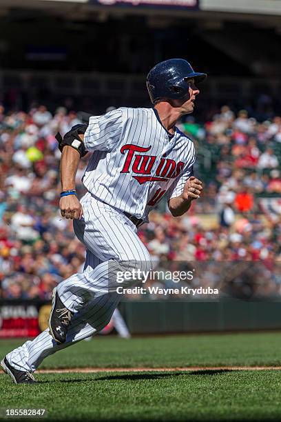 Clete Thomas of the Minnesota Twins runs for first base against the Cleveland Indians on September 29, 2013 at Target Field in Minneapolis,...