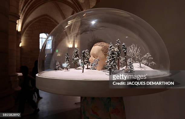 The artwork "The Past is a Foreign Country" by German artist Friedrich Kunath is displayed on October 22, 2013 at the Conciergerie museum in Paris,...