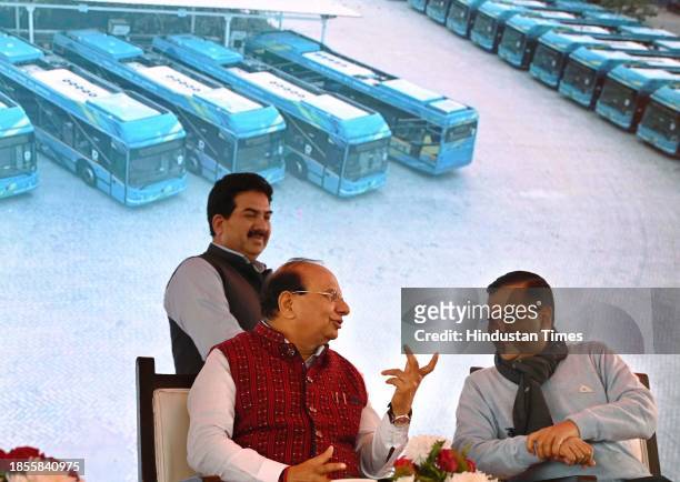 Delhi Lieutenant Governor Vinai Kumar Saxena and Chief Minister Arvind Kejriwal during the flagging off ceremony of 500 new electric buses at IP...