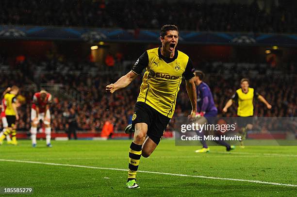 Robert Lewandowski of Borussia Dortmund celebrates scoring their second goal during the UEFA Champions League Group F match between Arsenal and...