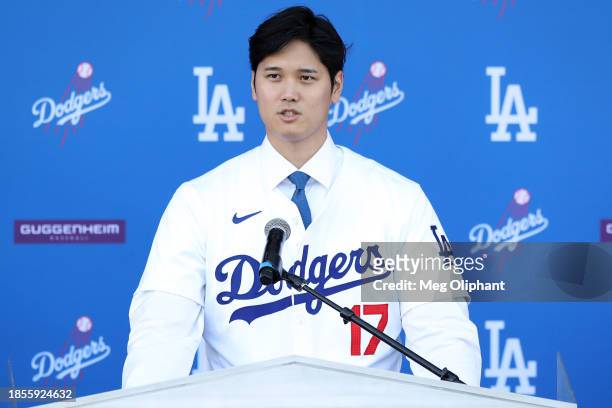 Shohei Ohtani of the Los Angeles Dodgers speaks to the media at Dodger Stadium on December 14, 2023 in Los Angeles, California.
