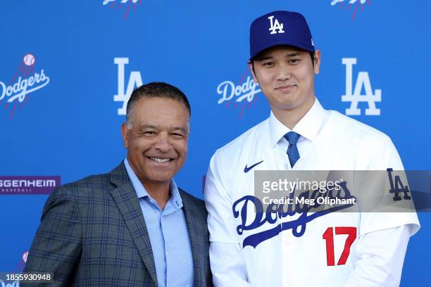 Shohei Ohtani poses for a photo with Manager Dave Roberts after being introduced by the Los Angeles Dodgers at Dodger Stadium on December 14, 2023 in...