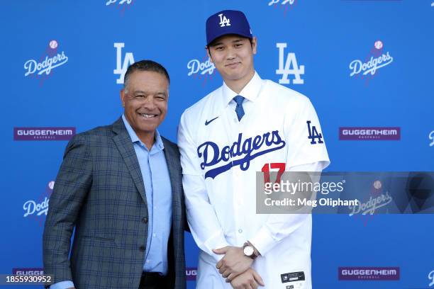 Shohei Ohtani poses for a photo with Manager Dave Roberts after being introduced by the Los Angeles Dodgers at Dodger Stadium on December 14, 2023 in...