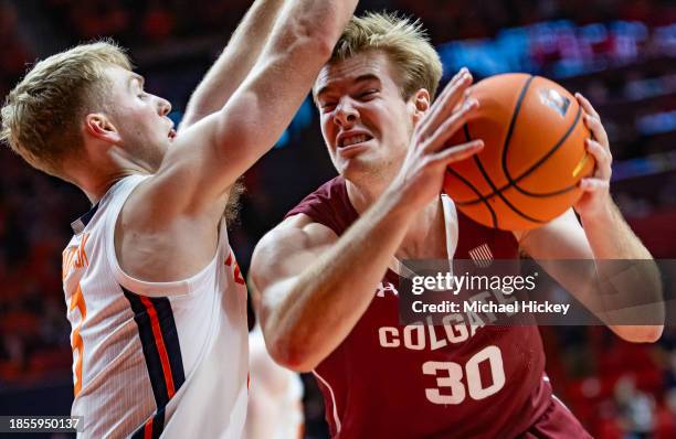 Sam Thomson of the Colgate Raiders makes a move to the basket against Marcus Domask of the Illinois Fighting Illini during the second half at State...