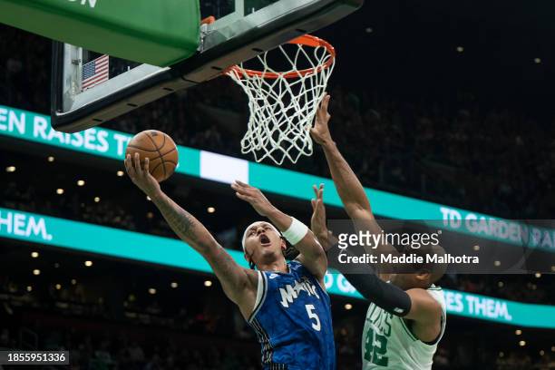 Paolo Banchero of the Orlando Magic drives to the basket against Al Horford of the Boston Celtics during the first half at TD Garden on December 17,...