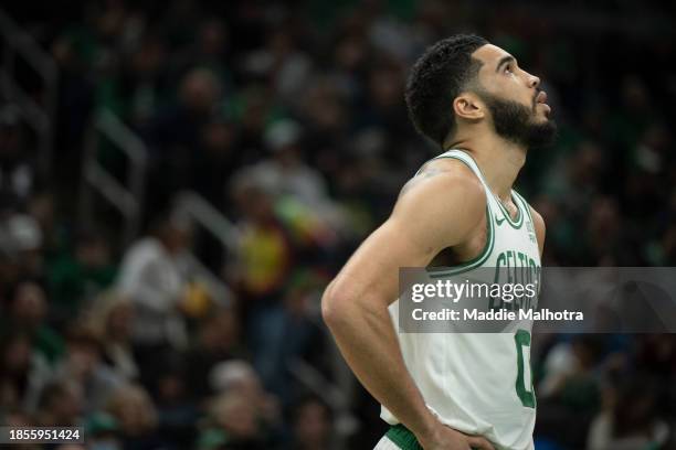 Jayson Tatum of the Boston Celtics looks on during the first half against the Orlando Magic at TD Garden on December 17, 2023 in Boston,...