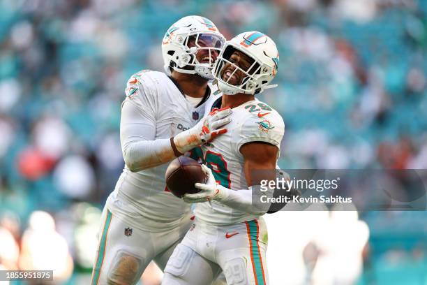 Brandon Jones of the Miami Dolphins celebrates with Bradley Chubb after intercepting a pass during the fourth quarter of an NFL football game against...