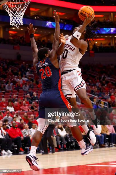 Louisville Cardinals guard Mike James goes up with his shot from the lane while being defended by Pepperdine Waves guard Ethan Anderson during a mens...