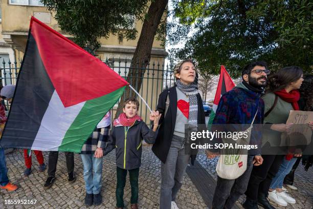 Activists hold hands during a demonstration near the Israeli embassy. The protest actions were organized by PUSP - Plataforma Unitária de...