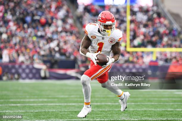 Jerick McKinnon of the Kansas City Chiefs runs with the football during the first half against the New England Patriots at Gillette Stadium on...