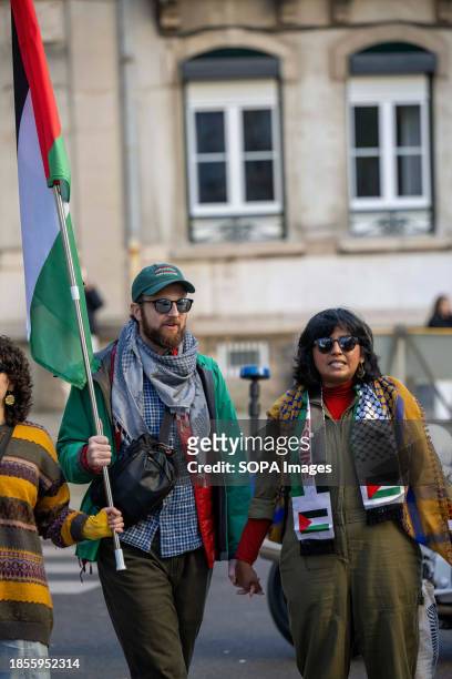 Activists hold hands during a demonstration near the Israeli embassy. The protest actions were organized by PUSP - Plataforma Unitária de...