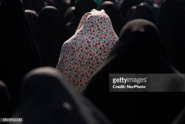Veiled Iranian women are praying during a religious ceremony to commemorate the death anniversary of Fatima, the daughter of Prophet Mohammad, in...