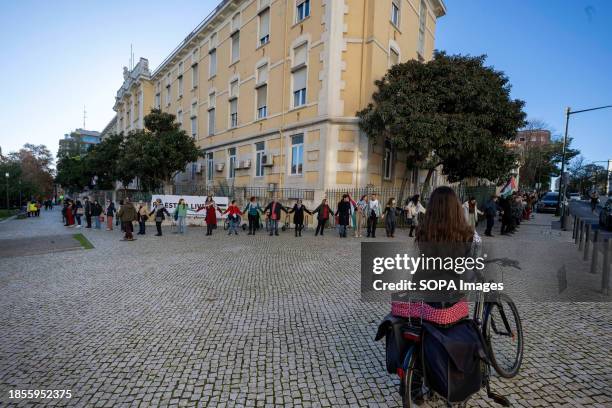 Activists hold hands during a demonstration near the Israeli embassy. The protest actions were organized by PUSP - Plataforma Unitária de...