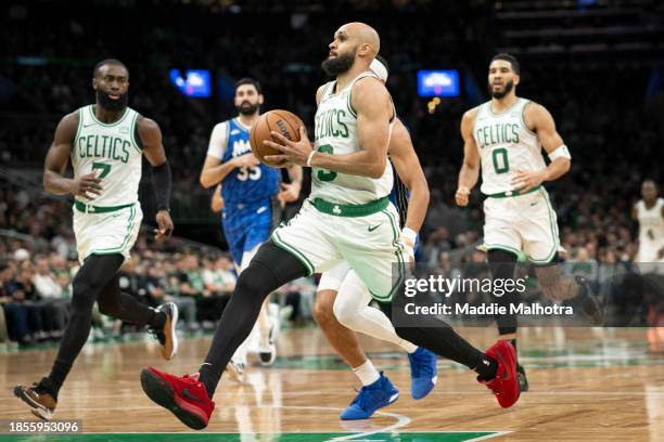Derrick White of the Boston Celtics drives to the basket during the second half against the Orlando Magic at TD Garden on December 17, 2023 in...