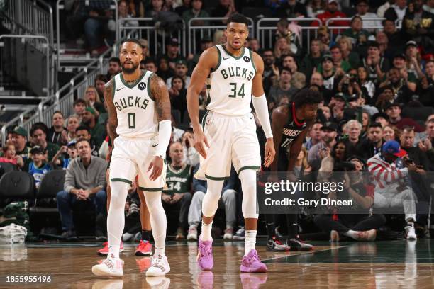 Damian Lillard of the Milwaukee Bucks and Giannis Antetokounmpo of the Milwaukee Bucks look on during the game against the Houston Rockets on...