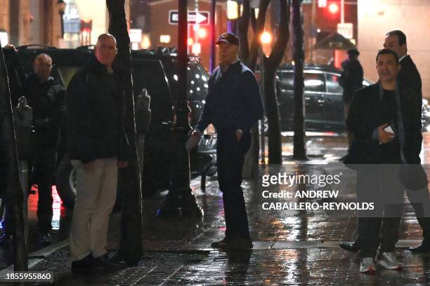 President Joe Biden looks on after a car hit an SUV in the motorcade as he left his campaign headquarters in Wilmington, Delaware on December 17,...
