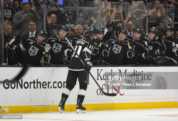Los Angeles, CA Kings teammates congratulate Kings center Anze Kopitar, at the bench after he scored a goal against the Winnipeg Jets at Crypto.com...