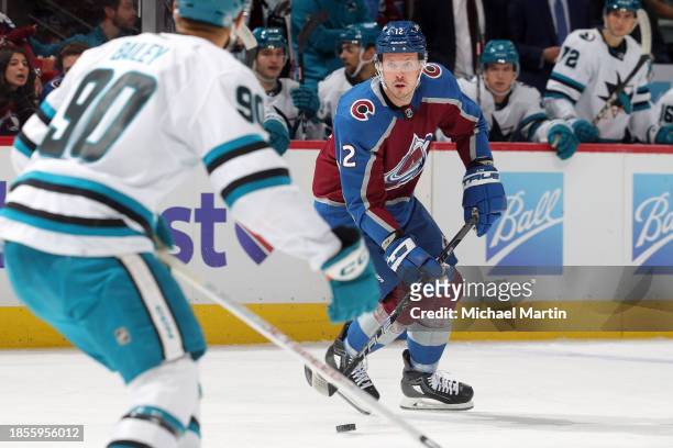 Ryan Johansen of the Colorado Avalanche skates against Justin Bailey of the San Jose Sharks at Ball Arena on December 17, 2023 in Denver, Colorado.