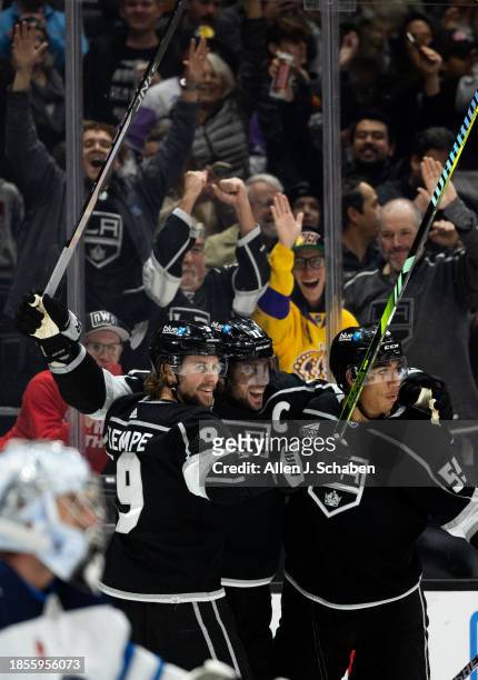 Los Angeles, CA Kings fans and Kings right wings Adrian Kempe, left, and Quinton Byfield, right, celebrate Kings center Anze Kopitar, center, goal...