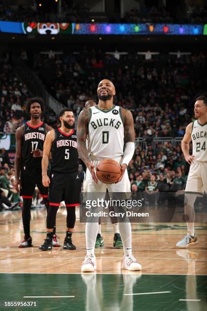 Damian Lillard of the Milwaukee Bucks prepares to shoot a free throw during the game against the Houston Rockets on December 17, 2023 at the Fiserv...