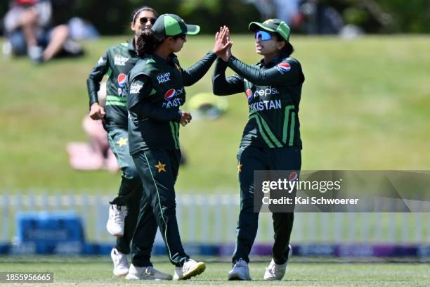 Nashra Sandhu of Pakistan is congratulated by team mates after dismissing Suzie Bates of New Zealand during game three of the Women's ODI series...