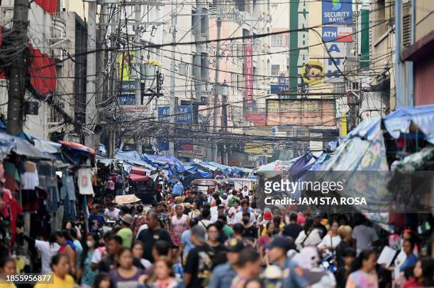 Shoppers crowd Divisoria market in Manila on December 18 a week before Christmas.