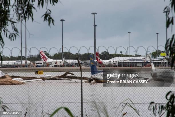 This picture shows a flooded area at Cairns Airport in Cairns on December 18, 2023. Flash floods swamped northeastern Australia on December 18, with...