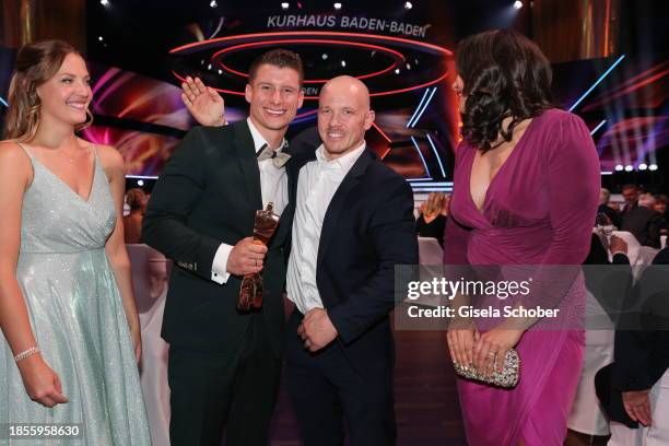 Viktoria Dauser, winner and world champion gymnast Lukas Dauser with award and gymnast/ gold medalist Fabian Hambuechen and Viktoria Hambüchen during...