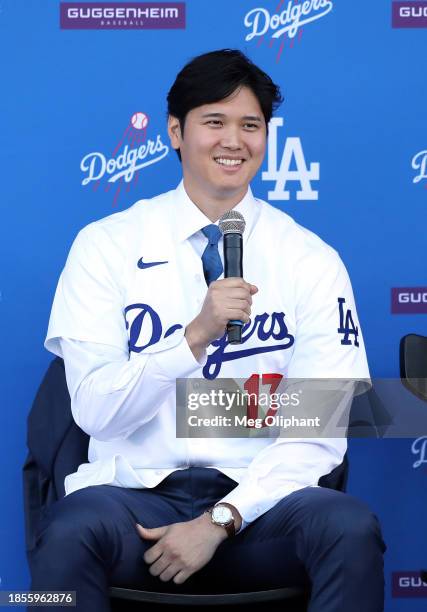 Shohei Ohtani of the Los Angeles Dodgers speaks to the media at Dodger Stadium on December 14, 2023 in Los Angeles, California.