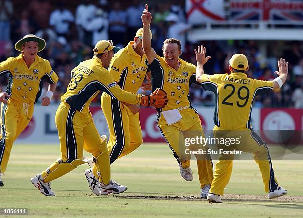 Australian bowler Andy Bichel celebrates after running out Sri Lankan batsman Aravinda De Silva for 11 runs during the World Cup Semi Final between...