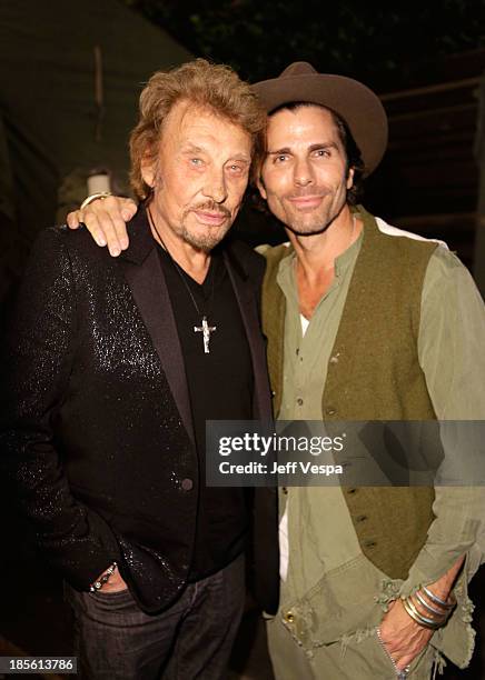 Singer Johnny Hallyday and designer Greg Lauren attend Barneys New York, Marc Forster & Katherine Ross' celebration of Greg Lauren's New Designer...