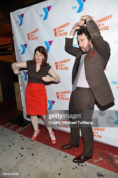 Actors Kate Flannery and Jonathan Kite spell out "Y-M-C-A" at the 10th Annual Comedy For A Cause event benefiting the Hollywood Wilshire YMCA at The...