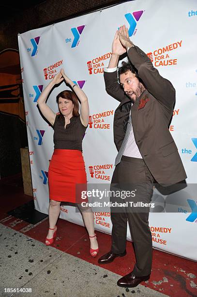 Actors Kate Flannery and Jonathan Kite spell out "Y-M-C-A" at the 10th Annual Comedy For A Cause event benefiting the Hollywood Wilshire YMCA at The...