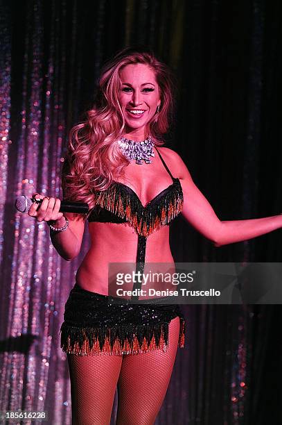 Jaime Lynch from the cast of FANTASY performs during their calendar launch at the Luxor Hotel and Casino on October 22, 2013 in Las Vegas, Nevada.